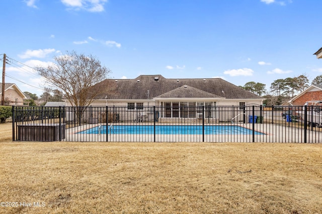 view of swimming pool with a patio area and a yard