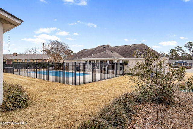 view of swimming pool with a lawn and a patio