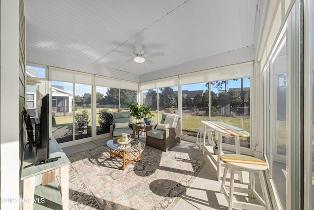 sunroom / solarium with ceiling fan and plenty of natural light