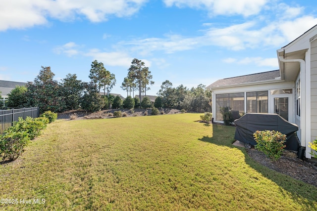 view of yard featuring a sunroom