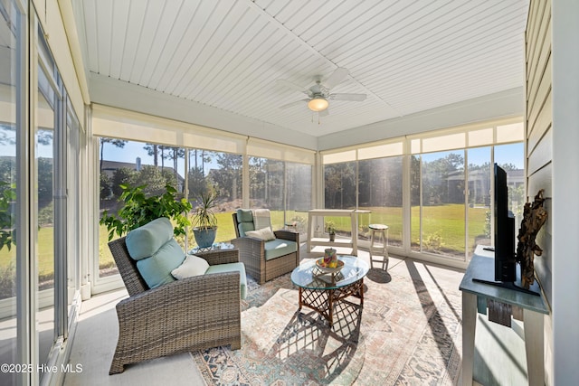 sunroom / solarium with ceiling fan and plenty of natural light