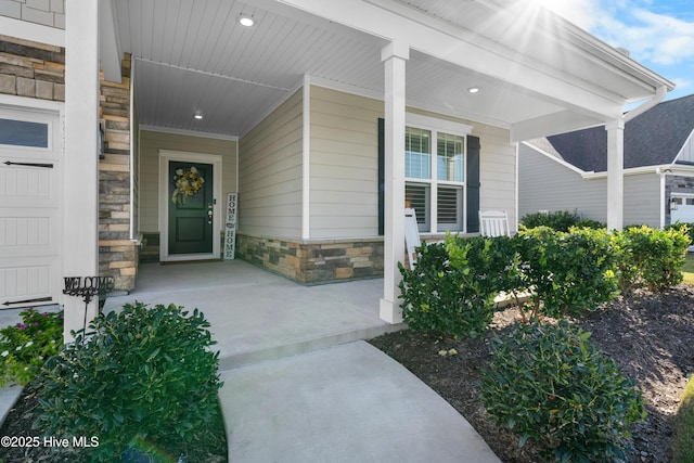 doorway to property featuring covered porch