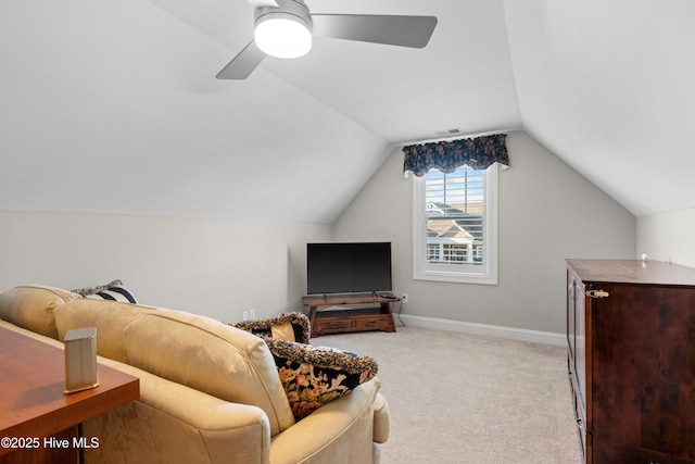 interior space featuring ceiling fan, light carpet, and vaulted ceiling