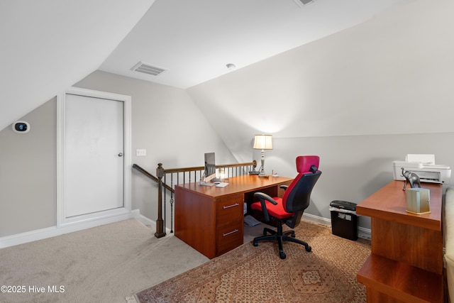 office space with light carpet and vaulted ceiling