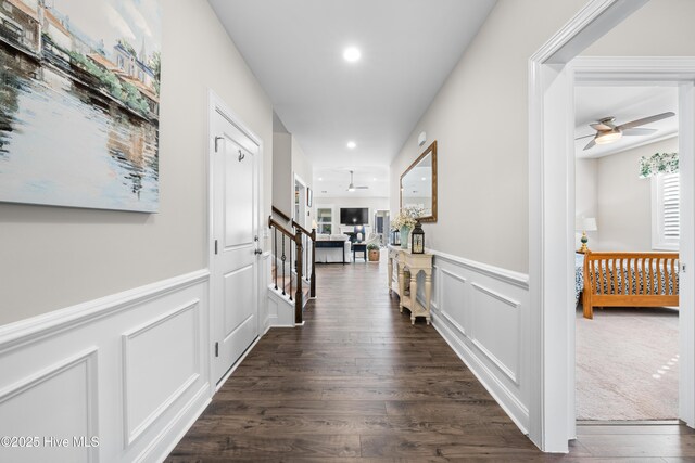 corridor with dark hardwood / wood-style floors