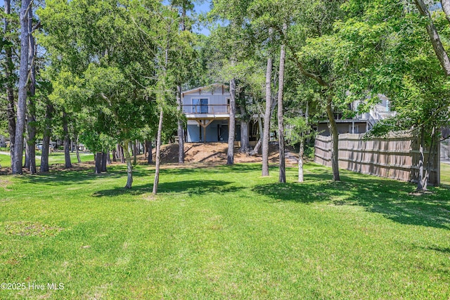 11 White Ln, Oak Island, NC 28465 - view of yard with a wooden deck