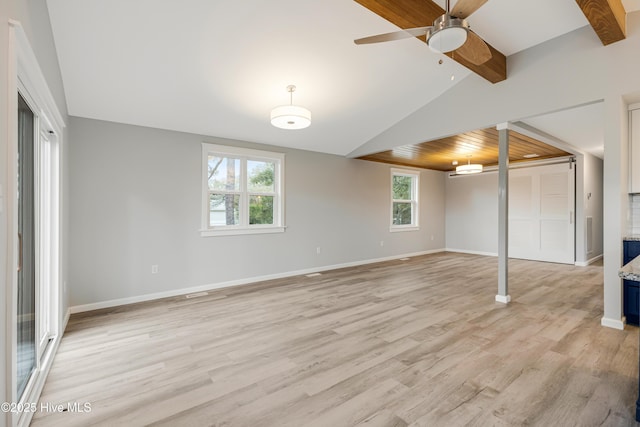 basement featuring light hardwood / wood-style flooring and ceiling fan