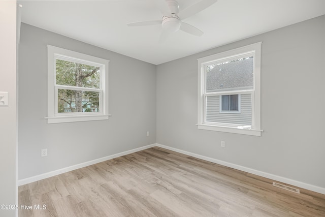 unfurnished room with ceiling fan and light hardwood / wood-style flooring