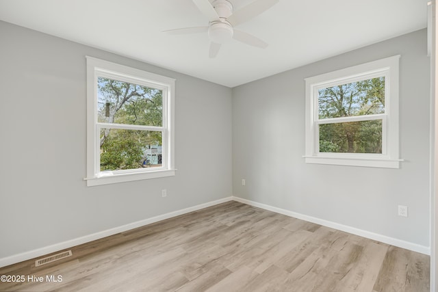 spare room featuring ceiling fan and light wood-type flooring