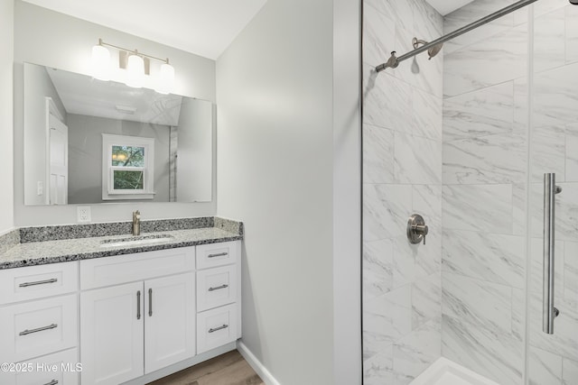 11 White Ln, Oak Island, NC 28465 - bathroom with a stall shower, vanity, and wood finished floors