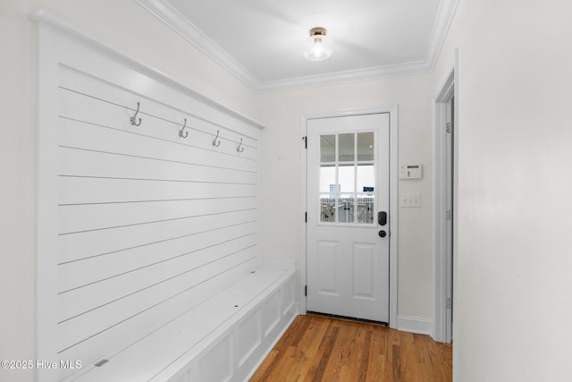 mudroom featuring hardwood / wood-style flooring and crown molding