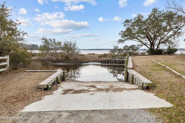 dock area with a water view