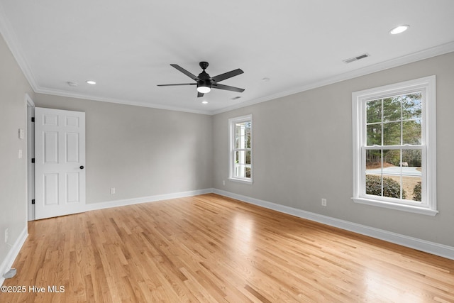 empty room featuring crown molding, light hardwood / wood-style floors, and ceiling fan