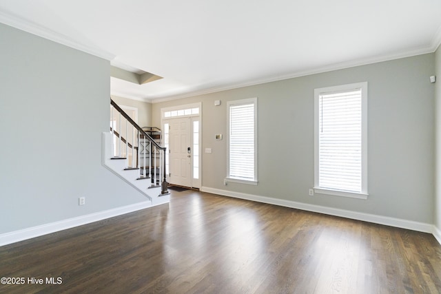 entryway with crown molding and dark hardwood / wood-style flooring