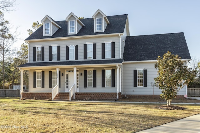 view of front of home with a porch and a front yard