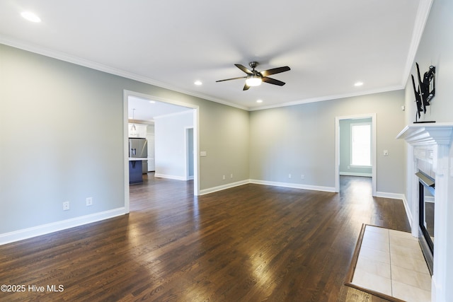 unfurnished living room with crown molding, dark wood-type flooring, and ceiling fan