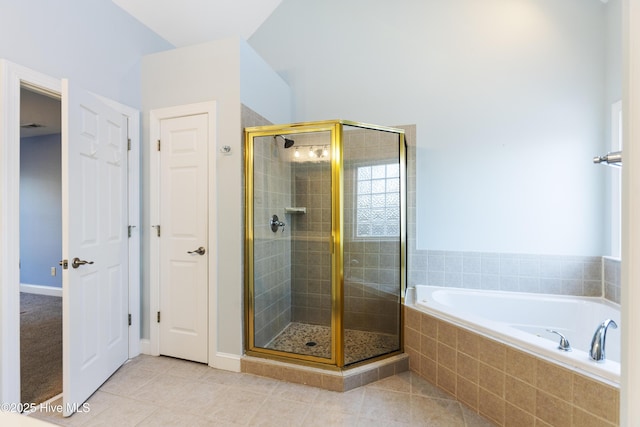 bathroom featuring tile patterned floors and separate shower and tub