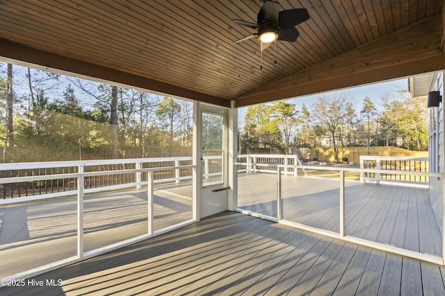 wooden deck featuring ceiling fan