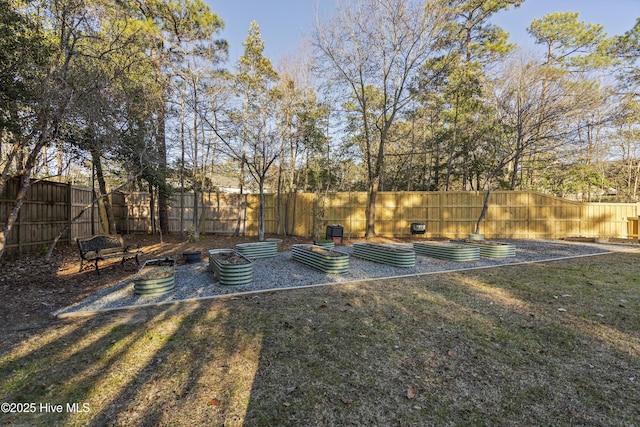 view of sport court with a lawn