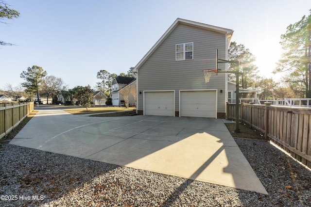 view of side of property with a garage