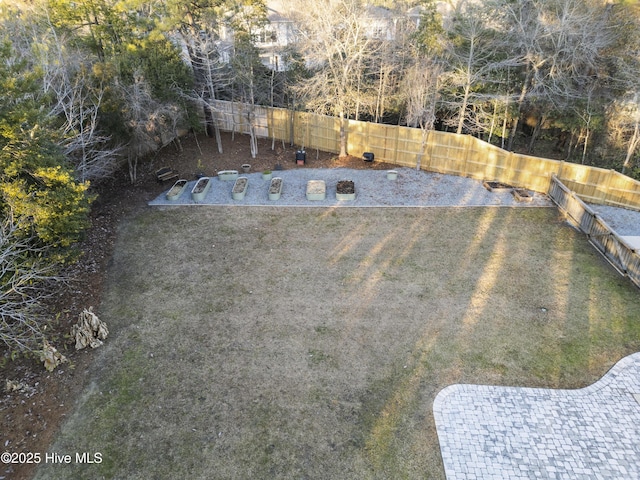 view of pool with a lawn