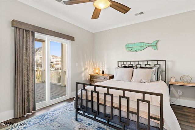 bedroom with access to exterior, visible vents, ceiling fan, wood finished floors, and baseboards