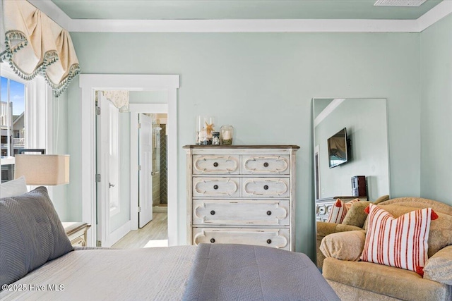 bedroom with light wood finished floors