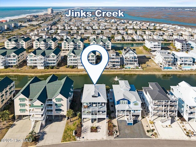 birds eye view of property featuring a water view and a residential view