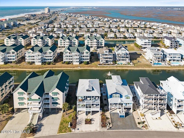 bird's eye view with a residential view and a water view