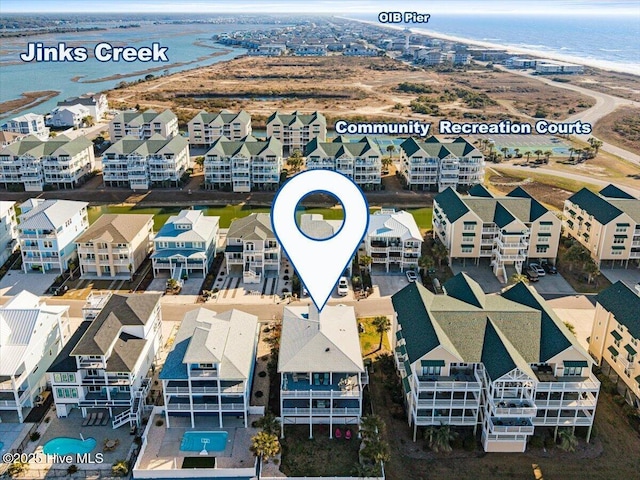 bird's eye view with a water view and a residential view