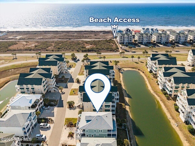 aerial view with a water view and a residential view