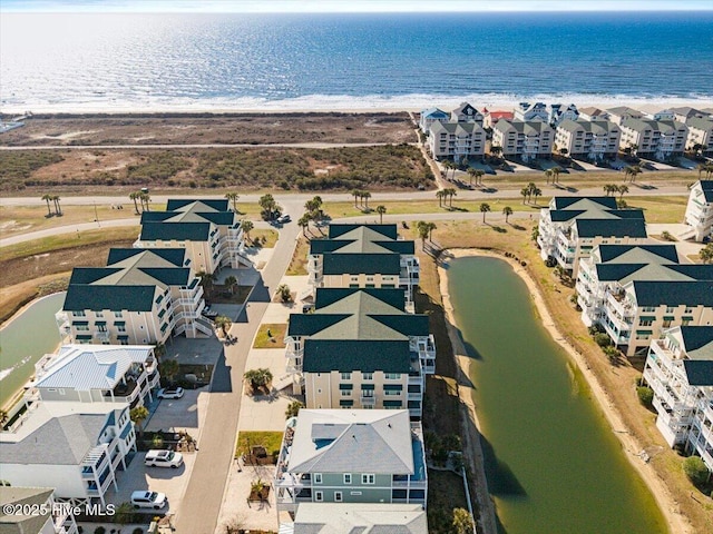 aerial view featuring a water view and a residential view