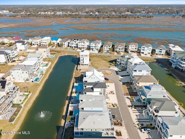 bird's eye view featuring a water view and a residential view