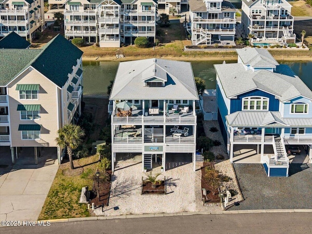 birds eye view of property featuring a residential view and a water view