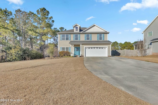 front facade with a front lawn and a garage