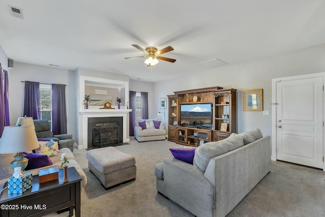 living room with light carpet and ceiling fan