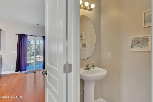 bathroom featuring wood-type flooring