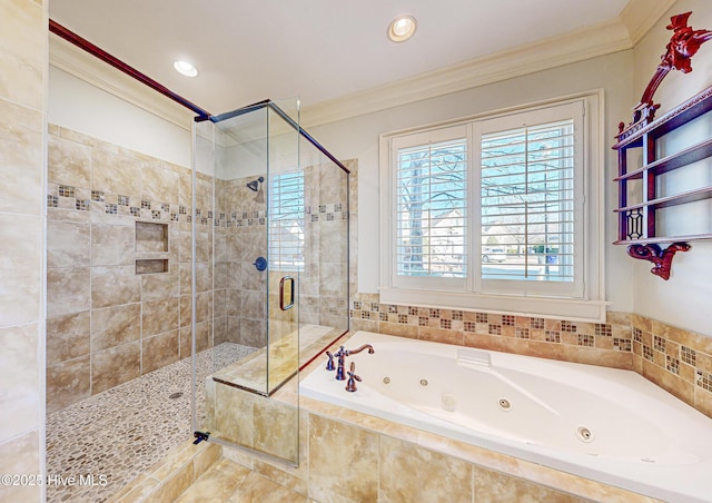 bathroom with crown molding and separate shower and tub