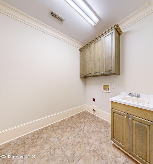 laundry area featuring cabinets, electric dryer hookup, sink, ornamental molding, and hookup for a washing machine