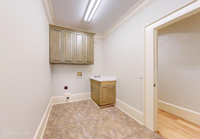 laundry room with cabinets, sink, ornamental molding, and hookup for a washing machine