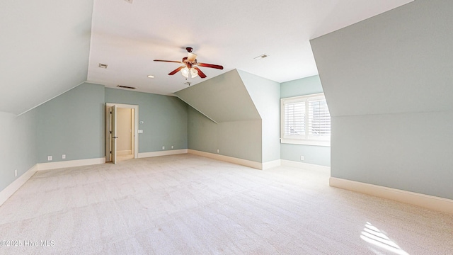 bonus room featuring lofted ceiling, ceiling fan, and light carpet