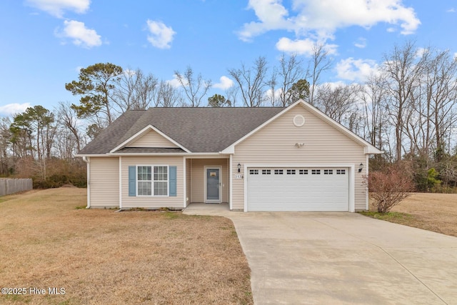 ranch-style home featuring a garage and a front lawn