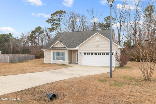 view of front facade with a front lawn and a garage