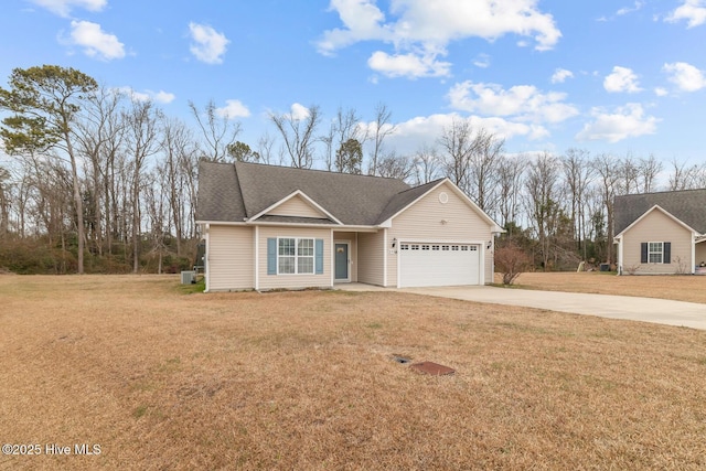 view of front of property featuring a garage and a front yard