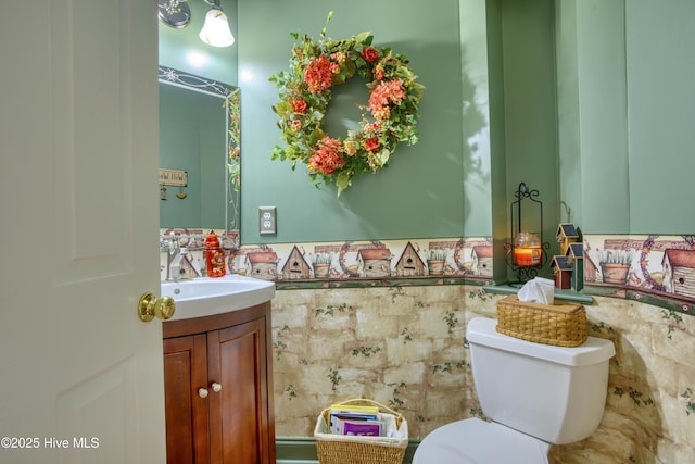 bathroom with toilet and vanity