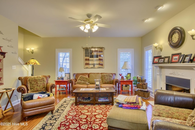 living room featuring hardwood / wood-style flooring and ceiling fan