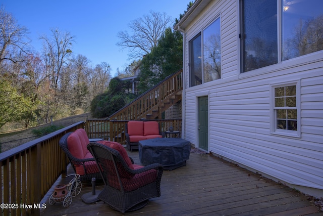 wooden terrace featuring an outdoor hangout area