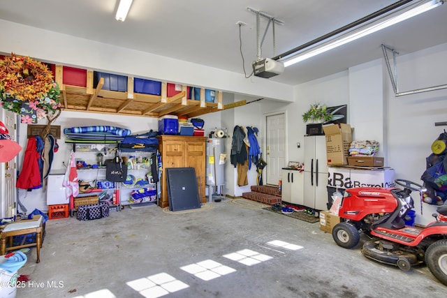 garage featuring water heater and a garage door opener