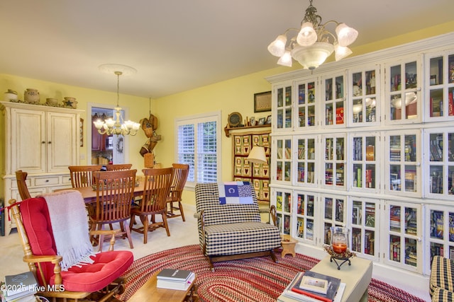 living area featuring an inviting chandelier