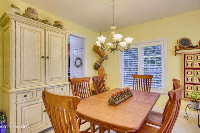 dining space with a notable chandelier